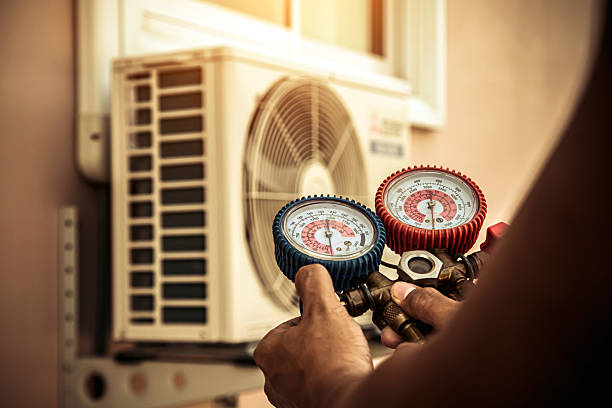 Professional Heat Pump Repair technician working in Corona, CA